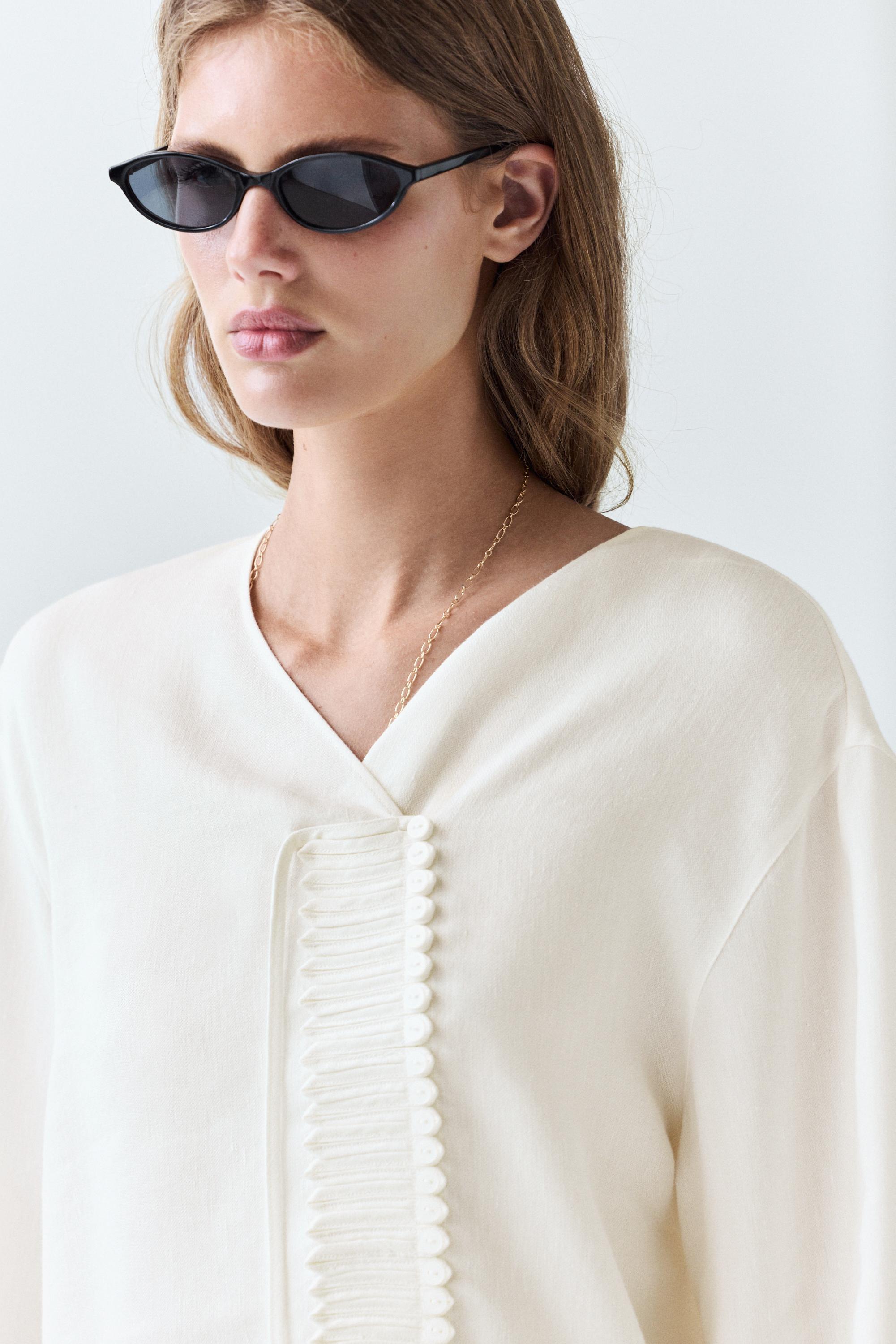 Flowing linen blend blouse with button detail